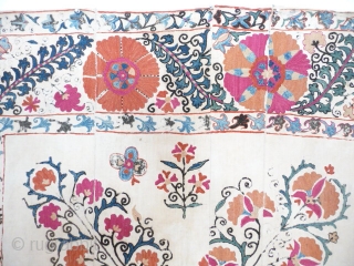 Lovely old suzani , 19th cent. good colours with a powerful border , unlined with some of the embroidery rubbed and repairable damaged area in the centre, cotton ground strong, not pristine  ...