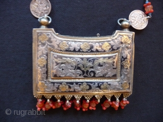 Amulet Box; Uzbekistan or the Caucasus; Superb quality niello work inlaid with silver and gold decorated with coral,rose quartz and turquoise , the box 19thcent. the chain later with Tsarist era silver  ...