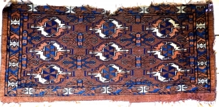 A 'Brown Yomut 9 Gul Torba from the second half of the 19th century
Size 85 x 40cm
In fragmented condition with even wear and losses to top and bottom, interesting additional details in  ...
