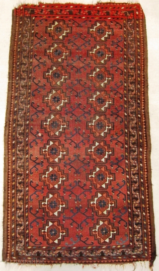 A late 19th century Ersari  Rug 

Size 145 x 78 cm

An Ersari small rug with chuval guls, simplified dyrnak secondary motif and lively shudur main border. Overall even flat wear with  ...