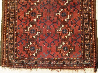 A late 19th century Ersari  Rug 

Size 145 x 78 cm

An Ersari small rug with chuval guls, simplified dyrnak secondary motif and lively shudur main border. Overall even flat wear with  ...