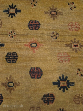 Mid 19th century Tibetan Prayer rug in Ningxia yellow, size 84cm x 141cm, Fringes on both ends are not original there are three small repairs in the field. Pile wear to centre.  ...