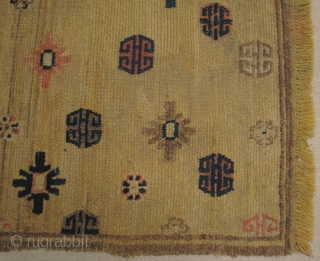 Mid 19th century Tibetan Prayer rug in Ningxia yellow, size 84cm x 141cm, Fringes on both ends are not original there are three small repairs in the field. Pile wear to centre.  ...