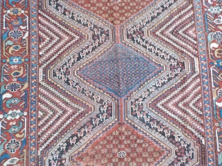 Attractive antique Khamseh with vibrant colours. Partially low pile and a small area with a reparation and a very small hole (see last two photos). Size is 220 x 153 cm.  