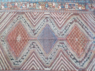 Attractive antique Khamseh with vibrant colours. Partially low pile and a small area with a reparation and a very small hole (see last two photos). Size is 220 x 153 cm.  