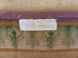Savonnerie 3 x 2 m. periode Charle X. Full pile and very nice wool quality. 2 small stain in the central medallion.           