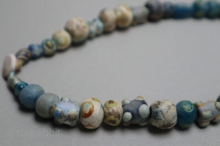 Ancient mosaic glass, stone and mother of pearl necklace, 2nd-1st centuries BCE, Caucasus or Asia Minor, restrung, 42cm long.              