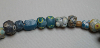 Ancient mosaic glass, stone and mother of pearl necklace, Caucasus or Asia Minor, 2nd-1st centuries BCE, restrung, 42cm long.              
