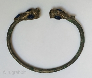 Ancient silver bracelet with lion heads, 2nd-1st century B.C., Near East, inlaid with blue glass, diam. 7.5 cm               