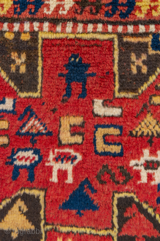 Unique Karachov rug circa 1900 with figures that look like aliens, pacmans and spaceships! An outer cross pattée border. Full pile in perfect condition. Original condition with no repiles or repairs. 4'4"  ...