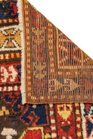 Unique Bordjalou Kazak rug circa 1900 with figures that look like aliens, pacmans and spaceships! An outer cross pattée border. Full pile in perfect condition. Original condition with no repiles or repairs.  ...