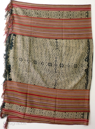 Large  men's wrap cloth, selimut, Insana/West Timor, Indonesia, mid 20th century, Ikat, commercial yarn, handwoven. Three panels, centre covered with very intriguing spiral motif, two colourfull striped panels   enclosing  ...