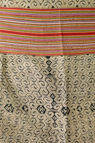 Large  men's wrap cloth, selimut, Insana/West Timor, Indonesia, mid 20th century, Ikat, commercial yarn, handwoven. Three panels, centre covered with very intriguing spiral motif, two colourfull striped panels   enclosing  ...