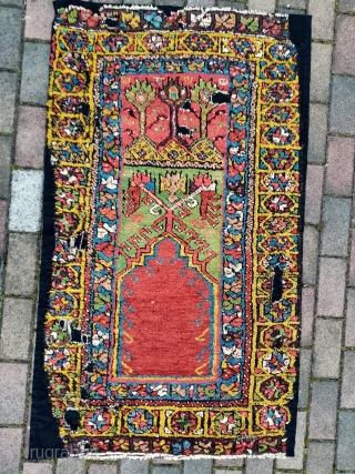 A Central Anatolian rug fragment. Original pile length. Cm 80 x 142. Professionally conserved. Two lions in the mihrab.              