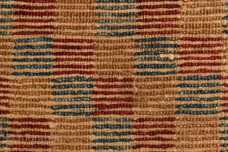 A fine Tibetan checkerboard rug. First half of twentieth century. Cm 162 x 90. Some old repairs.                