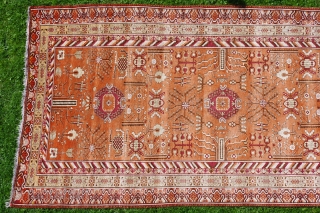 KHOTAN CARPET, ca. 1920, 427 cm X 219 cm, 
in best condition,very soft pile,
colours:black,white,browns,salmon,yellows,grey,orange,purple,
some very small reparations                