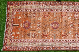 KHOTAN CARPET, ca. 1920, 427 cm X 219 cm, 
in best condition,very soft pile,
colours:black,white,browns,salmon,yellows,grey,orange,purple,
some very small reparations                