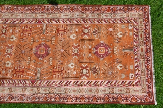 KHOTAN CARPET, ca. 1920, 427 cm X 219 cm, 
in best condition,very soft pile,
colours:black,white,browns,salmon,yellows,grey,orange,purple,
some very small reparations                