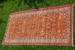 KHOTAN CARPET, ca. 1920, 427 cm X 219 cm, 
in best condition,very soft pile,
colours:black,white,browns,salmon,yellows,grey,orange,purple,
some very small reparations                