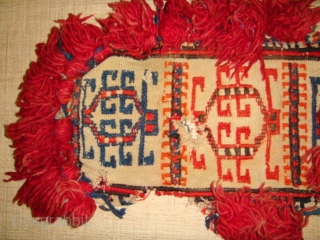 Late 19th to Early 20th Century Decorative Turkmen Camel Neckband Trapping. Red-Orange and Blue Soumakh - weave designs on White Flatweave Base. All Wool.
Dimensions: Length: 84cm  Width: 22cm (Length inclusive of  ...