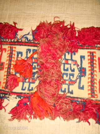 Late 19th to Early 20th Century Decorative Turkmen Camel Neckband Trapping. Red-Orange and Blue Soumakh - weave designs on White Flatweave Base. All Wool.
Dimensions: Length: 84cm  Width: 22cm (Length inclusive of  ...