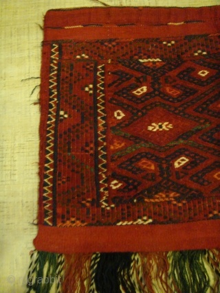 Early 20th Century Yamoud Turkmen Torba (Shallow Tent Bag). All Wool. Front face only, without backing. Design: The distinctive "Bastani" Gul of the Yamoud Clan.
Dimensions: Horizontal: Approx.78cm. Vertical: Approx.42cm. Fringe(V): Approx.20cm.  