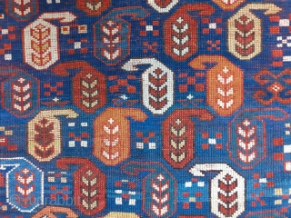 Antique Kazak rug in an indigo blue ground with polychrome boteh / buta motifs.  ~1880-90. 102x170cm (3'4"x5'6"). Rare natural colors which can not be seen in late examples - apricot, emerald  ...