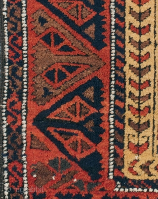 This antique Baluch Khorasan rug in a camel field has a design bar of three hexagons, each enclosing a serrated star (Turkmen ashyk motif) and arrows around an eternal knot motif. The  ...