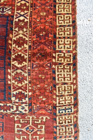 Kizil Ayak Turkmen Ensi. Assymetric knots open right.  Cotton highlights in white and blue. Some very small repairs.  

5'1" x 3'11"          