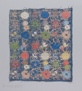 A Ming dynasty textile fragment with incredible color and a bevy of Chinese symbols dispersed throughout it's two layered design. The top design is done in silk brocade, while the underlying design  ...
