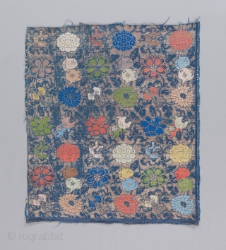 A Ming dynasty textile fragment with incredible color and a bevy of Chinese symbols dispersed throughout it's two layered design. The top design is done in silk brocade, while the underlying design  ...