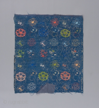 A Ming dynasty textile fragment with incredible color and a bevy of Chinese symbols dispersed throughout it's two layered design. The top design is done in silk brocade, while the underlying design  ...