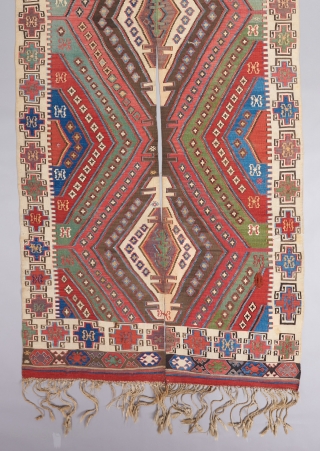 An early Anatolian Kilim in great condition woven in two panels. Great colors, great border,and rare to see one with the tassels fully intact. Quite fine as well. It has bits of  ...
