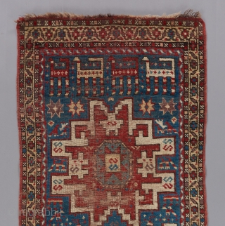 Lovely little caucasian rug. Red and brown wefting. 4'10" x 2'4".                      