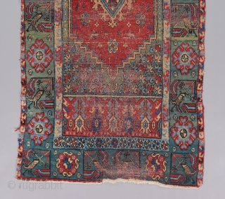 An early 19th century North African rug with a Ladik design rendered in a singular color palette. Contains some writing at the top. A rare and beautiful piece which is worthy of  ...