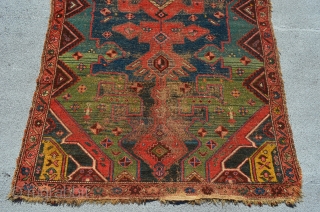 Kurdish rug. 7'3" x 4'2". Areas of wear and some glue on the back.                   