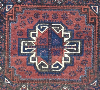 Baluch bagface with a turkoman inspired gol and charming light blue and yellow color highlights in the border.

2'10" x 2'5".             