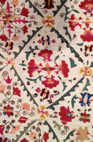Very pretty early 19th century Suzani with wonderful colors. Has stains but in decent condition otherwise. 4'9" x 3'2'.              