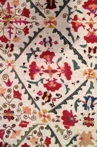 Very pretty early 19th century Suzani with wonderful colors. Has stains but in decent condition otherwise. 4'9" x 3'2'.              