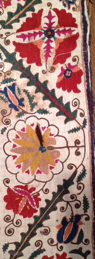 Very pretty early 19th century Suzani with wonderful colors. Has stains but in decent condition otherwise. 4'9" x 3'2'.              