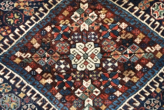 Qashqai bagface, very soft and fluffy wool with nice colors. Persian knot open left. Colorful flatwoven fasteners preserved at top, nice pile.           