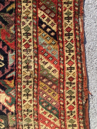 Mid 19th century northwest runner . Spectacular colors . Wool warps and cotton wefts. Cut at one end . A few small tears . App. 10' x 3'.     