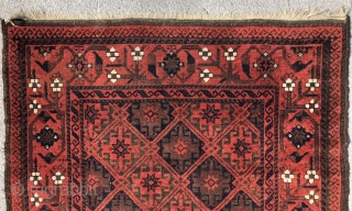 Baluch rug with a dignified presence . Precise drawing and very good color. Good condition with some wear and corrosion.             