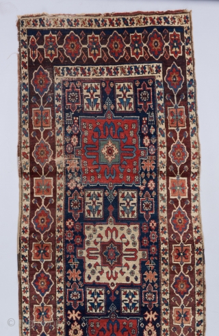 A beautiful Shahsavan runner with great age. 12'4". x 3''6". A dog stain towards the lower right and some heavier wear towards the bottom. Mostly in great pile.     