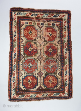 Moghan Kazak with very good age and presence. Prob mid 19th. 5'4" x 3'8". Condition issues as visible.               