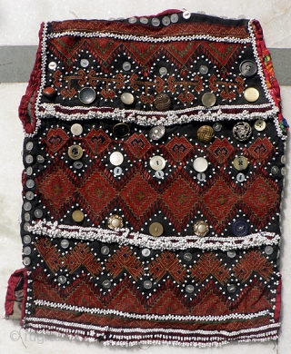 Indus Kohistan Child's Vest. Finely embroidered in tiny cross stitch and flat stitch, with intricate beadwork, baubles and buttons, demonstrating the mother's skill and love for her young child.  Early to  ...