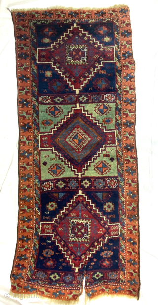 East Anatolian Kurd Yuruk Rug, Turkey, late 19th century. 2'7'' x 6'6'' (79 x 198 cm). Wool pile, wool warp, wool weft. Good pile and beautiful colors. Obvious split damage at one  ...
