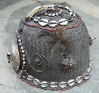 Old Naga Cane Woven Hat, from the state of Nagaland in NE India, probably Konyak, with lots of decorations, including boar tusk, glass beads, cowrie shells, sea shells, wood, bone, and feathers.  ...