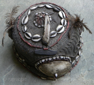 Old Naga Cane Woven Hat, from the state of Nagaland in NE India, probably Konyak, with lots of decorations, including boar tusk, glass beads, cowrie shells, sea shells, wood, bone, and feathers.  ...