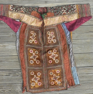 Superb Old Sind Wedding Choli. This spectacular heavily embroidered dress or choli from the Sind region was probably made and used by a bride in her wedding. The choli is fully embroidered  ...